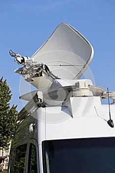 Satellite dish antenna on the top of a television car