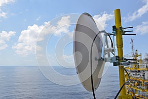 Satellite dish antennas under sky, Communication equipment in offshore oil and gas industry