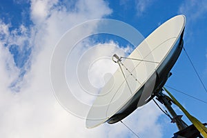 Satellite dish on blue sky