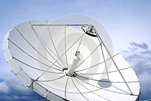 Satellite-dish on blue sky photo