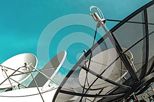 Satellite dish on blue sky background