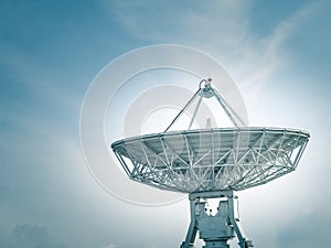 Satellite dish at earth station with a blue sky