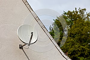 Satellite dish on a house wall