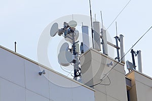 Satellite dish repeaters on the building roof