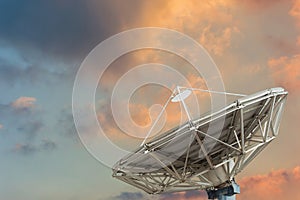 Satellite dish on sun set background