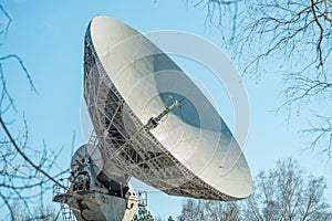 Satellite dish transmission data on blue background