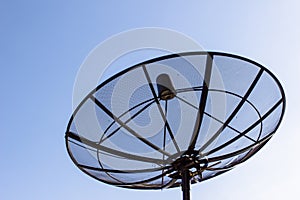 Satellite dish with twilight blue sky