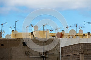 Satellite dishes and analog television antenna