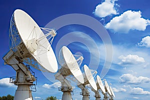 Satellite dishes on the bright blue sky background