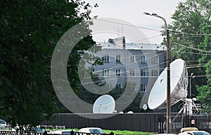 satellite dishes in a city, communication and research, military and civil telecom technology