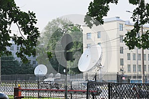 satellite dishes in a city, communication and research, military and civil telecom technology