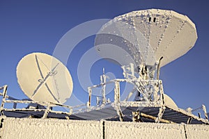 Satellite dishes covered by hoarfrost