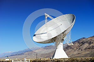 Satellite dishes in desert / clear blue sky