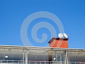 Satellite dishes on the roof. Cable TV. Signal reception. Modern communications