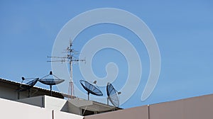 The satellite dishes, and TV antennas on the roof
