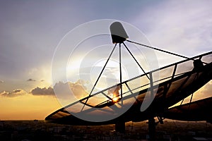 Satellite dishes on twilight sky background