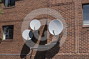Satellite dishes in various sizes and shapes waiting for television, data or internet signals