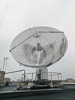 Satellite parabolic dish antenna on the roof for high speed internet link