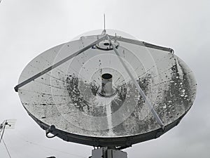 Satellite parabolic dish antenna on the roof for high speed internet link