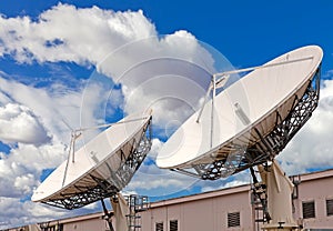 Satellite TV antenna on blue sky