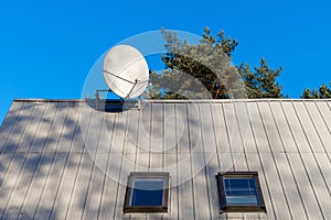 satellite TV antenna on the roof of the house