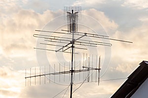 Satellite TV house antena with cloudy natural background