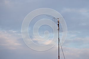 Satellite TV house antena with cloudy natural background