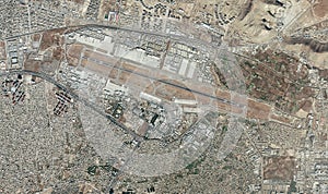 Satellite view of Kabul airport, Hamid Karzai International Airport, houses, streets and buildings in the neighboring area photo