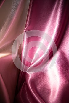 satin pink and white fabric on background