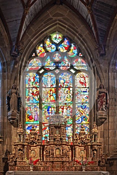 Satined glass window and altar of the church of Pleyben in FinistÃÂ¨re Brittany France