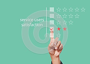 Satisfaction from service users concept. Hands of man finger customer satisfaction check star rating green background, person