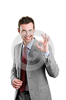 Satisfied business man showing okay sign photo