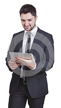 Satisfied businessman holding tablet