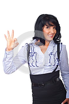 Satisfied businesswoman showing okay sign