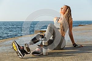 Satisfied disabled athlete woman with prosthetic leg