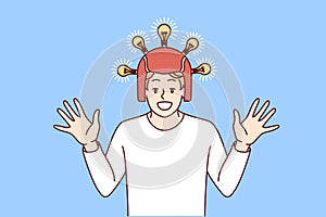 Satisfied excited man in helmet with glowing light bulbs raises hands and smiles. Vector image