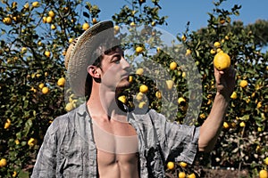 Satisfied farmer watch a lemon