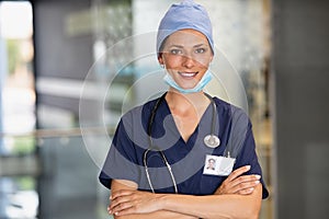 Satisfied female surgeon at hospital