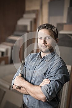 Satisfied joinery worker holding chisel