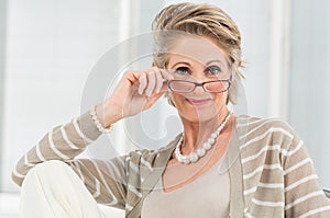 Satisfied Mature Woman Wearing Eyeglass