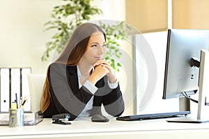 Satisfied office worker watching computer content