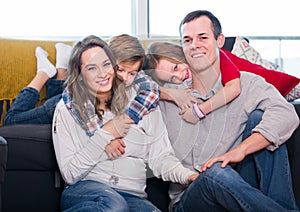 Satisfied parents and children happy to spend time at home