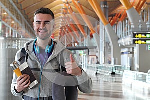 Satisfied traveler giving a thumbs up from the airport