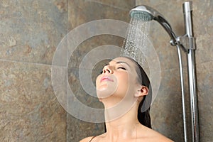 Satisfied woman having shower on a bathroom
