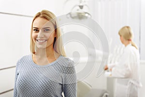 Satisfied woman leaving dental room
