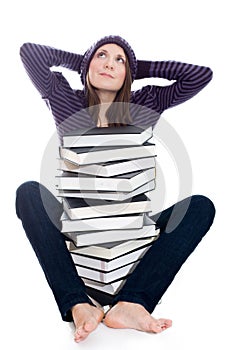 Satisfied woman with stack of books