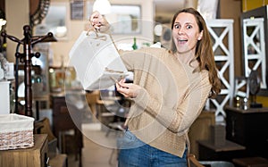 Satisfied woman with stylish basket