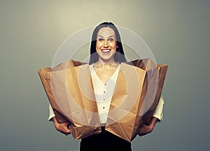 Satisfied young woman with paper bags