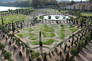 Satisfying, big and green yard of Versailles Castle in Paris, France, fountain, flowers and garden