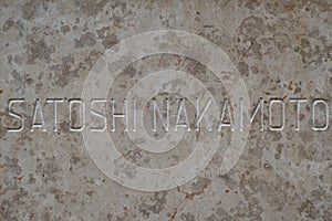 Satoshi nakamoto text on a marble table